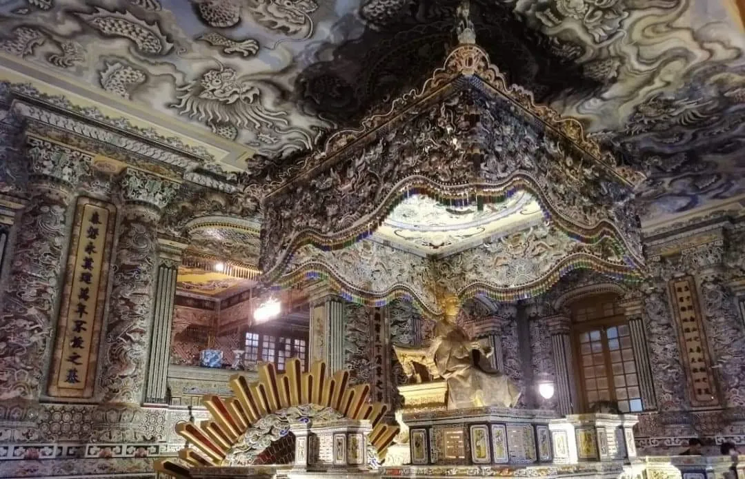 Ornate gilded altar and dragon decoration inside Khải Định’s tomb