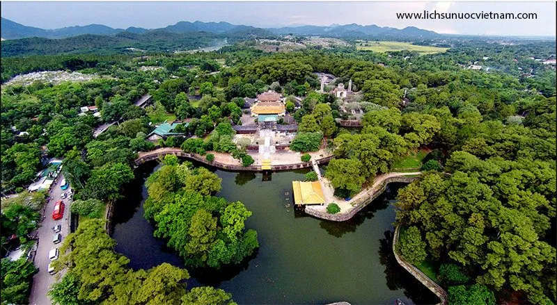 Aerial view of Tự Đức’s tomb: pavilions and a lake among green pine forest